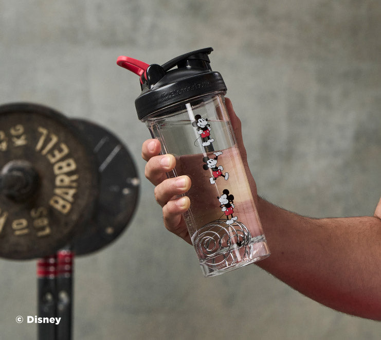 pro-series-m1 Mickey_Mouse_Protein_Shaker_Bottle_Being_Held_In_the_Gym.jpg